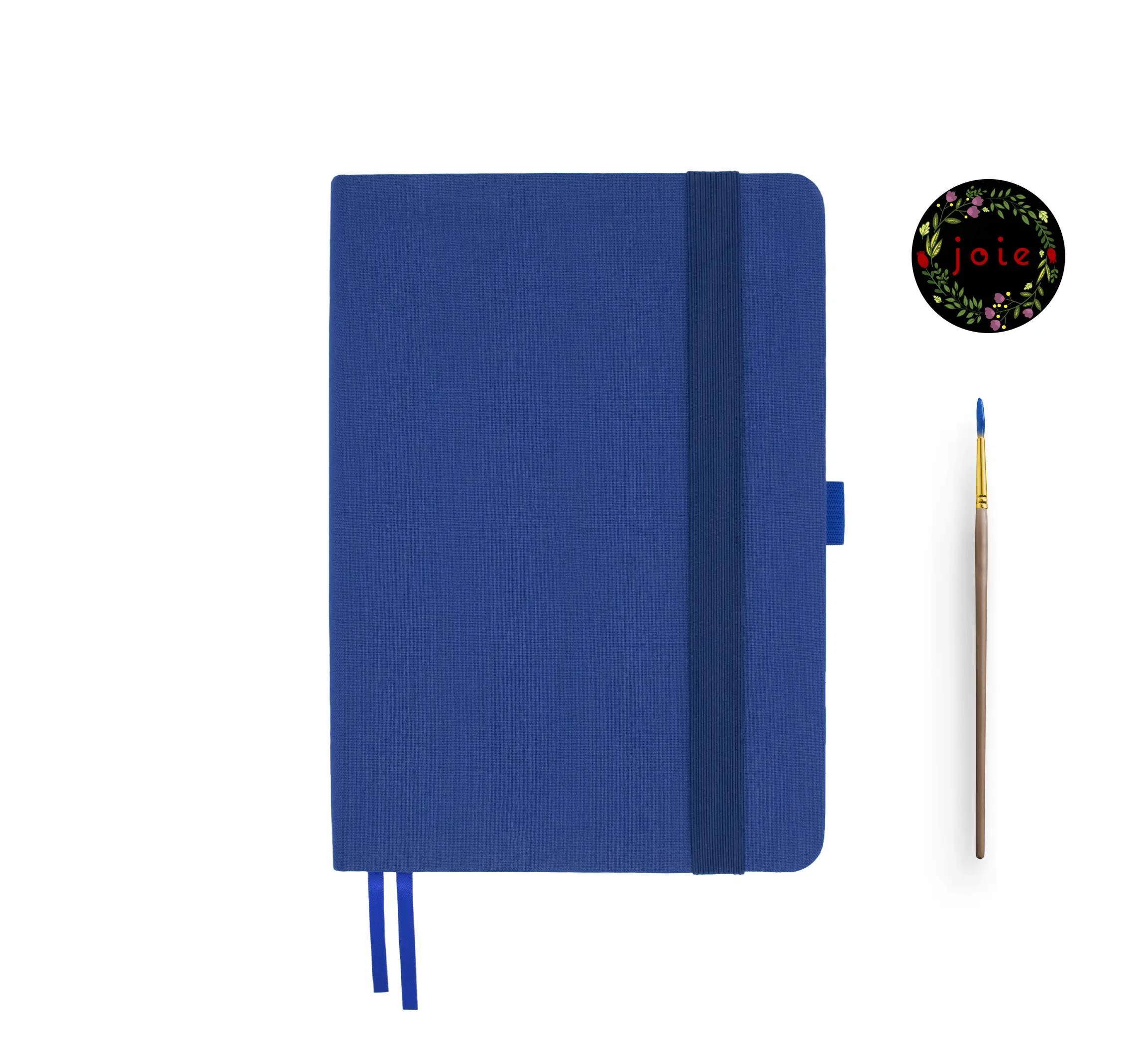 Blue A5 fabric dot grid notebook with elastic band, pen loop, dual bookmarks, Joie floral logo, and blue-tip paintbrush – ideal for journaling, planning, and creative work