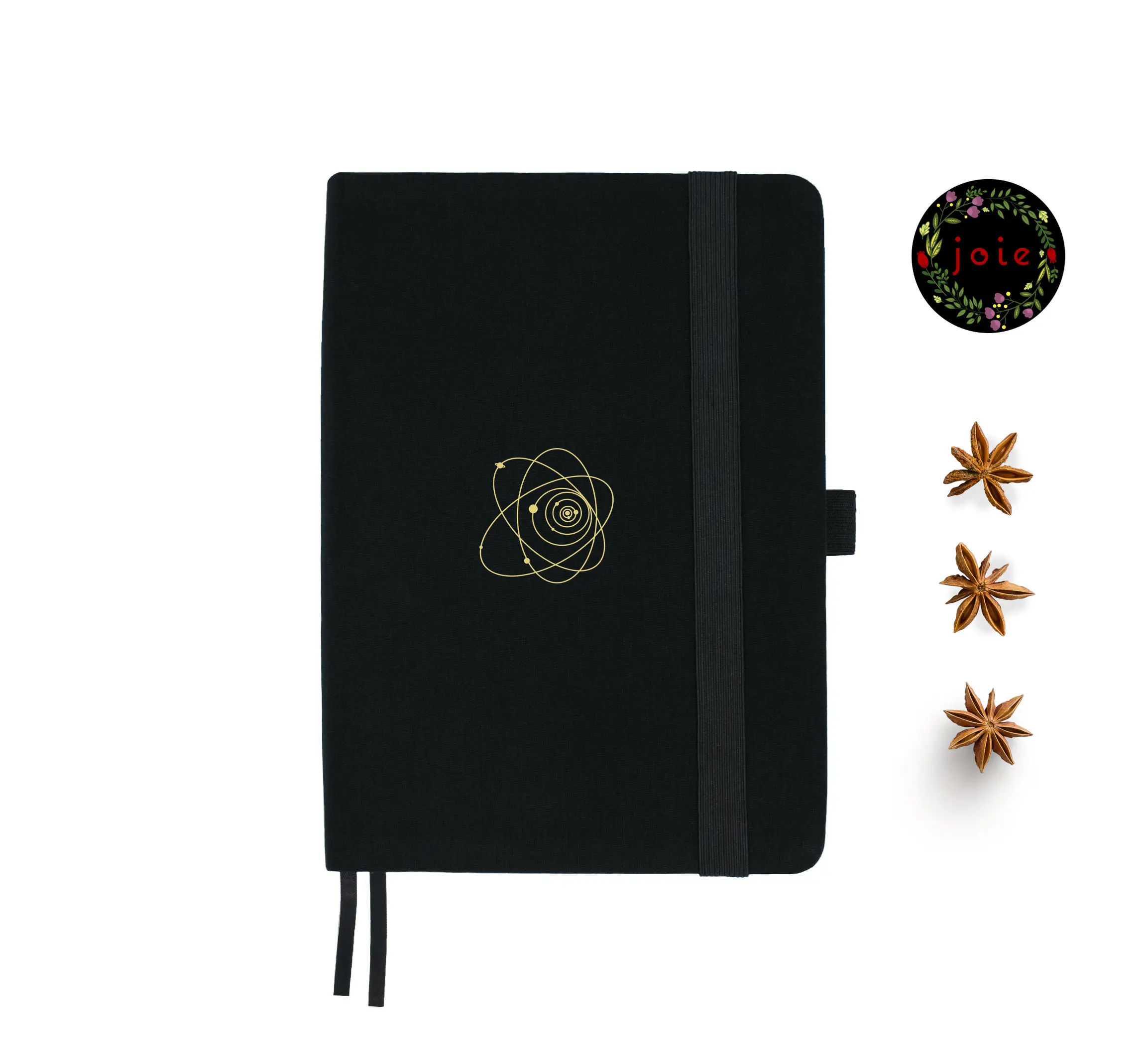 A5 dot grid notebook with a fabric cover and gold illustration of the Universe